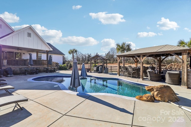 view of pool featuring a gazebo, a patio area, and ceiling fan