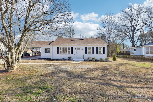 single story home featuring a front yard and a carport