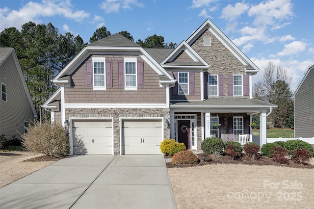 view of front facade with a garage and a porch