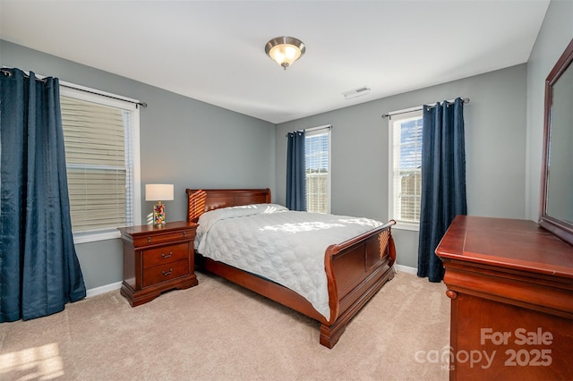 bedroom with light carpet