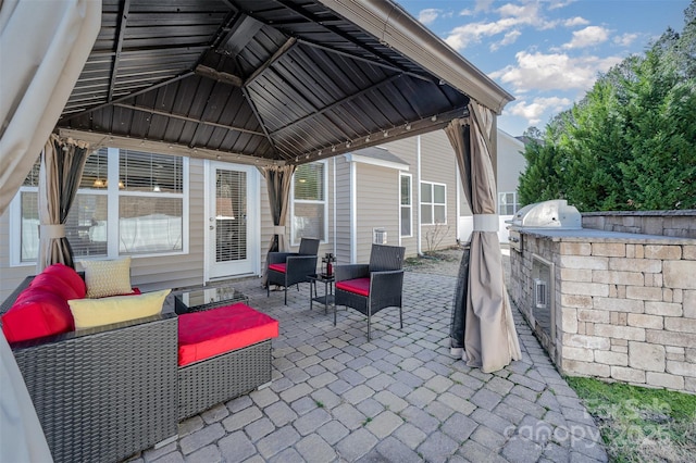 view of patio with a gazebo, outdoor lounge area, and exterior kitchen