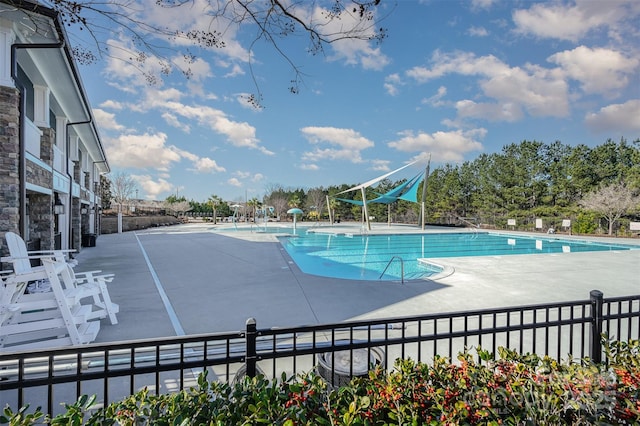 view of pool featuring a patio