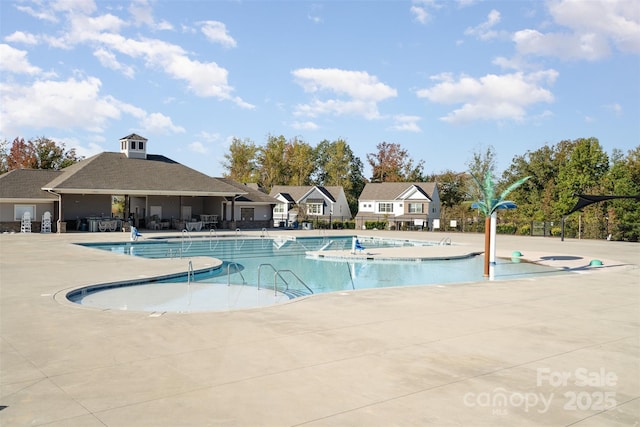 view of swimming pool with a patio area