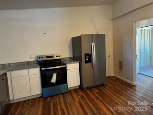 kitchen featuring white cabinetry, dark hardwood / wood-style floors, and appliances with stainless steel finishes