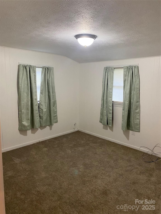 110 Heywood Rd Unit 20, Arden, NC 28704 - empty room with a textured ceiling and dark colored carpet
