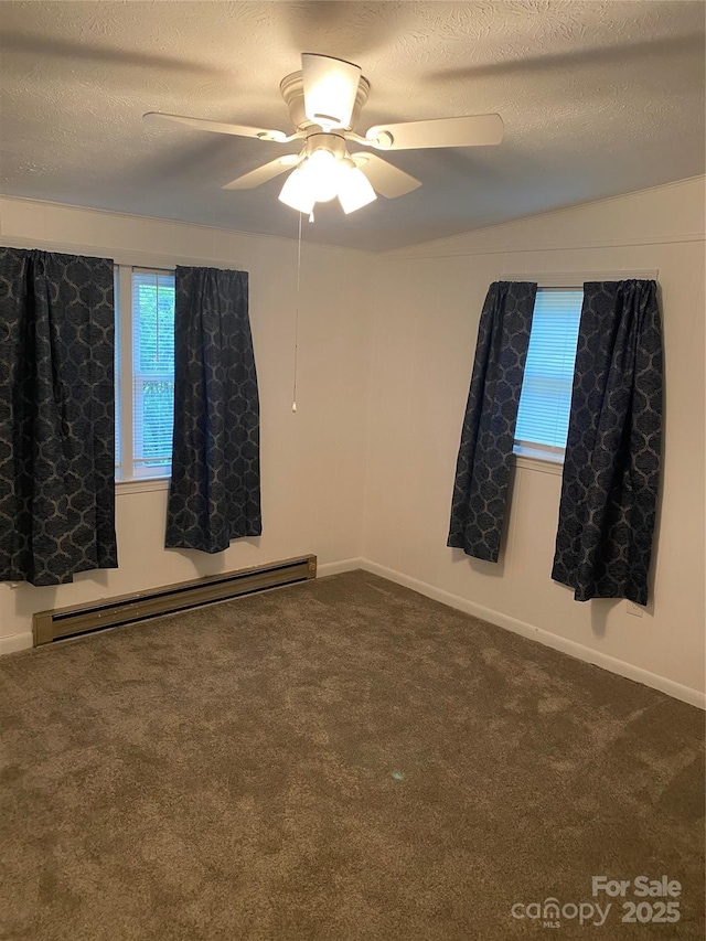 110 Heywood Rd Unit 20, Arden, NC 28704 - empty room with baseboard heating, carpet flooring, a textured ceiling, ceiling fan, and baseboards