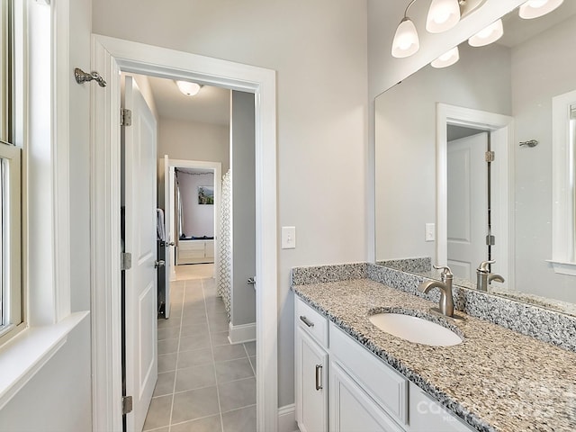 bathroom with tile patterned flooring and vanity