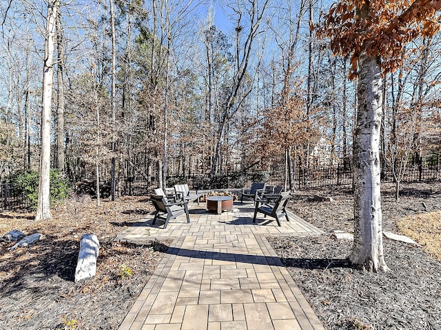 view of patio with an outdoor fire pit