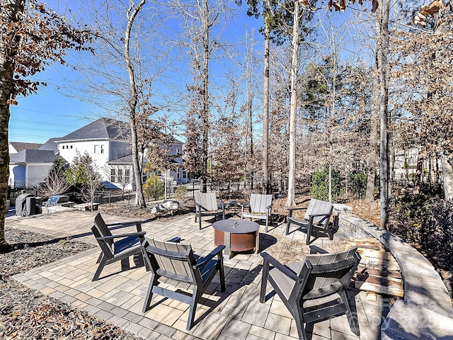 view of patio with a fire pit