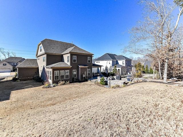 back of property with a patio