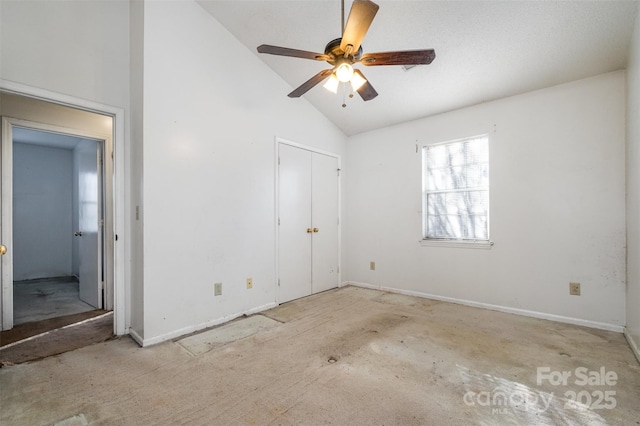 unfurnished bedroom featuring ceiling fan and high vaulted ceiling