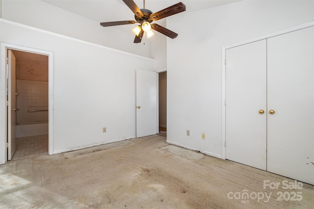 unfurnished bedroom with ceiling fan and ensuite bath