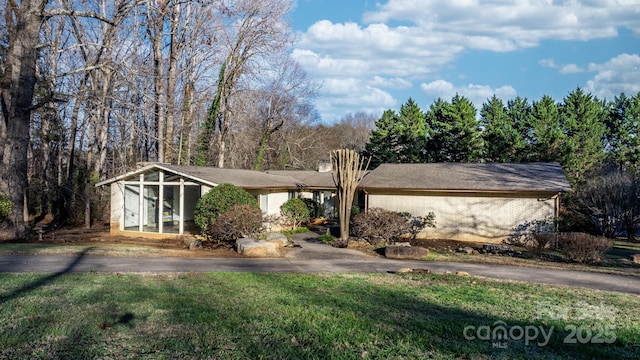 ranch-style house with a sunroom