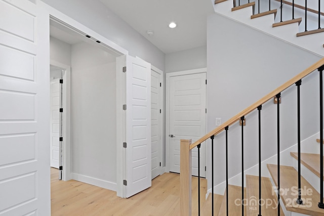 staircase featuring hardwood / wood-style flooring