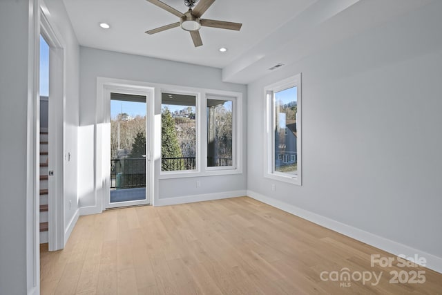 unfurnished room featuring ceiling fan and light wood-type flooring