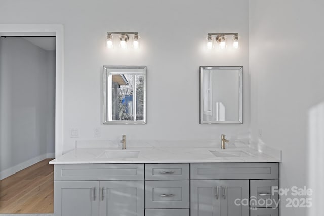 bathroom featuring vanity and hardwood / wood-style flooring