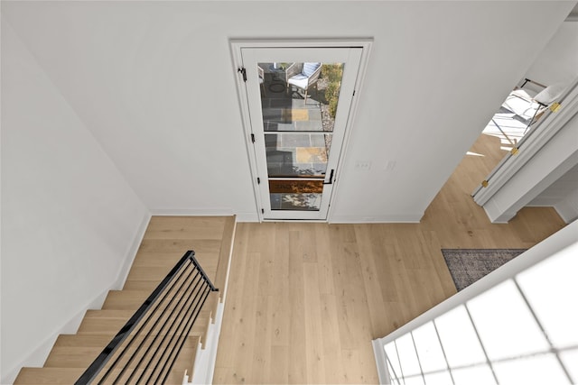 stairway featuring hardwood / wood-style floors