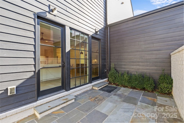 doorway to property featuring a patio