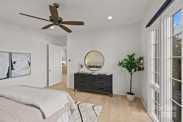 bedroom with ceiling fan and light wood-type flooring