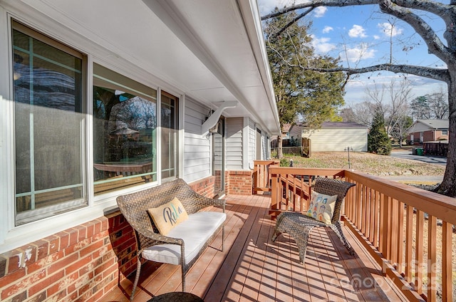 wooden terrace with a porch