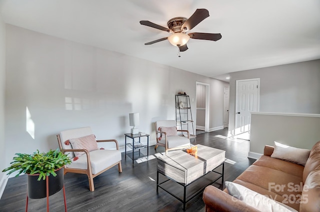 living room with dark wood-type flooring and ceiling fan