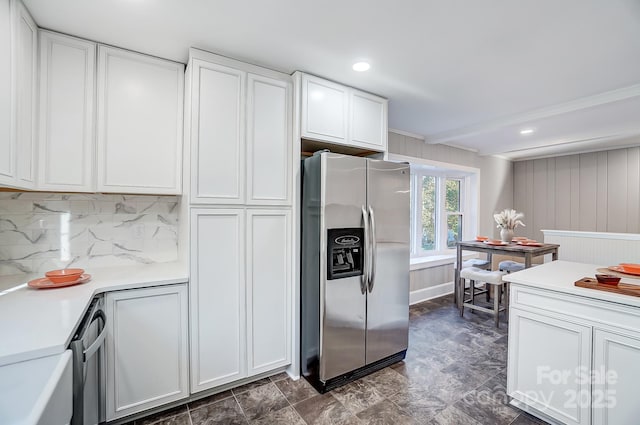 kitchen featuring white cabinetry, stainless steel fridge, beamed ceiling, and tasteful backsplash