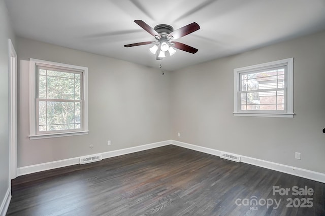 unfurnished room with dark hardwood / wood-style floors and ceiling fan