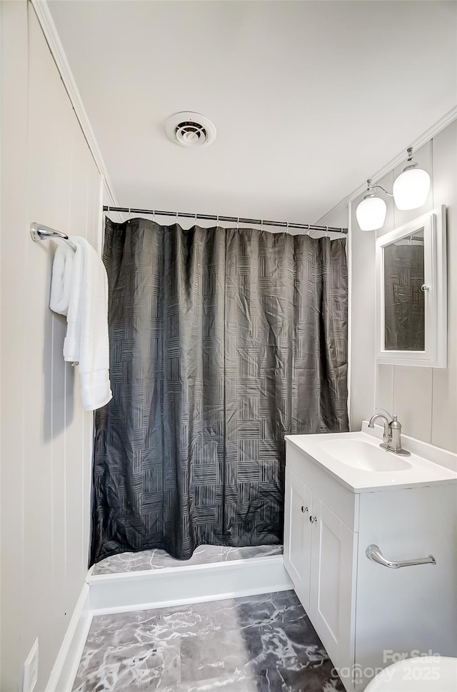 bathroom featuring vanity and a shower with shower curtain