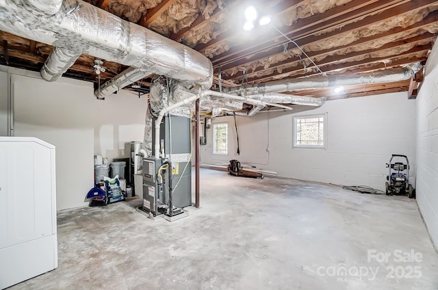 basement with washer / clothes dryer and heating unit