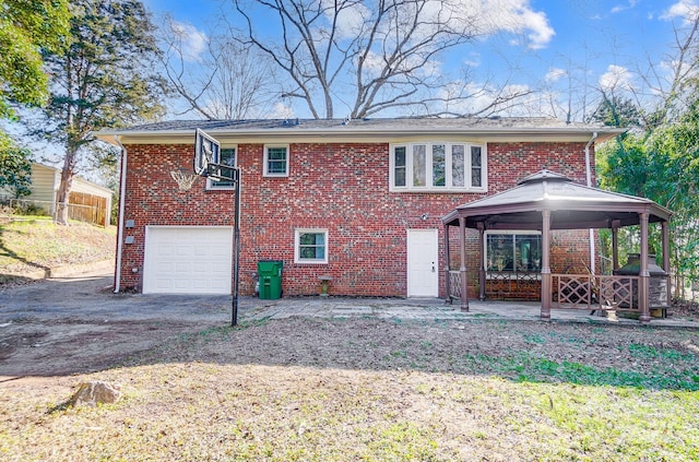 view of front of home featuring a garage and a gazebo