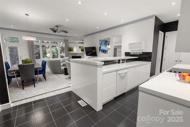 kitchen with white cabinetry, decorative light fixtures, dark tile patterned floors, ceiling fan, and black electric stovetop