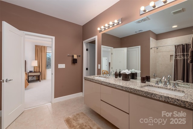 bathroom with tile patterned flooring, vanity, and a shower with shower curtain