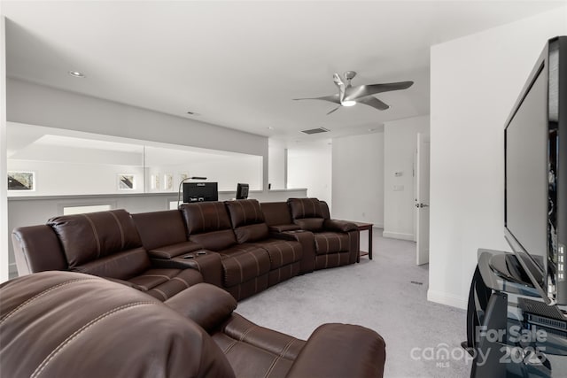 carpeted living room featuring ceiling fan