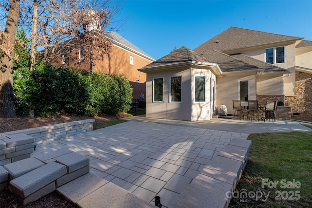 back of house featuring a patio