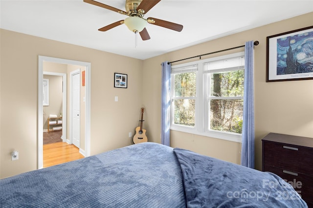 bedroom with light wood-type flooring and ceiling fan