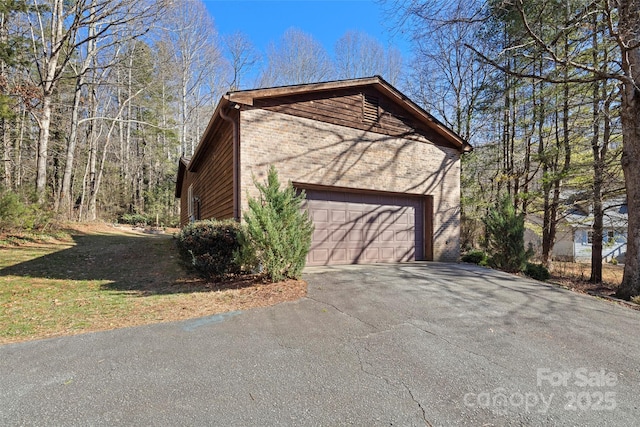 view of property exterior with a garage