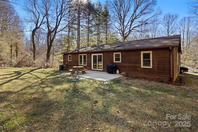 back of property featuring a lawn and a patio