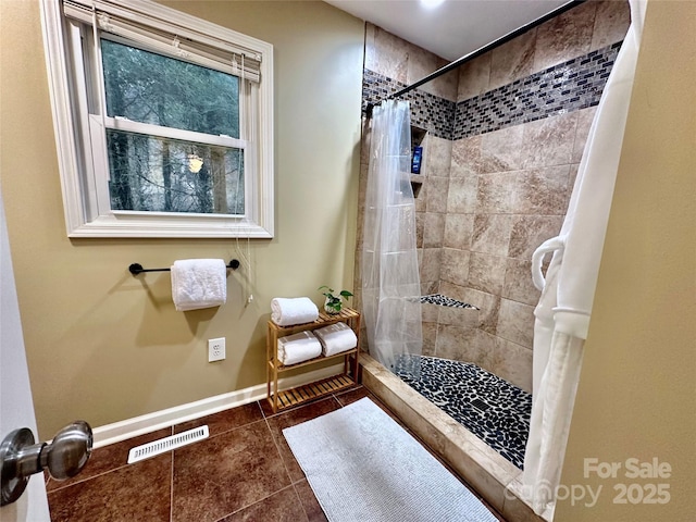 bathroom featuring tile patterned floors and walk in shower