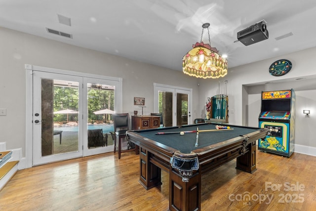 recreation room featuring french doors, light wood-type flooring, and billiards