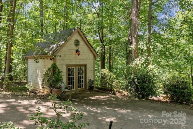 view of outbuilding featuring french doors