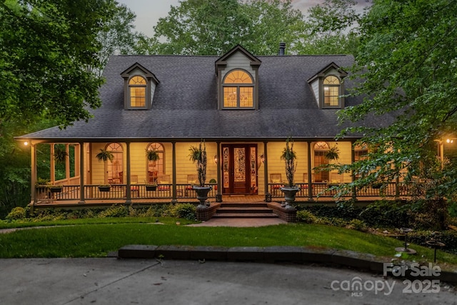 rear view of house with covered porch