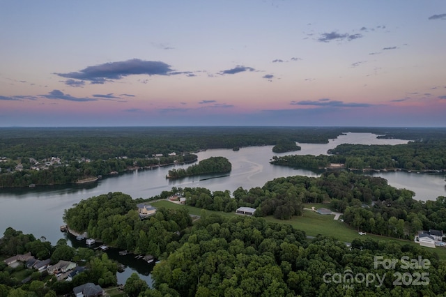 aerial view at dusk with a water view