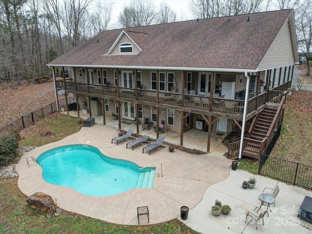 view of swimming pool with a patio area and a wooden deck