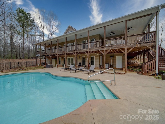 view of pool featuring ceiling fan and a patio area