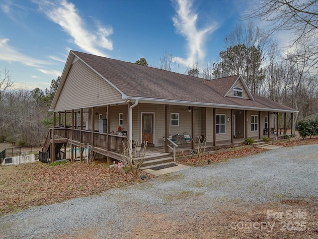 country-style home featuring covered porch