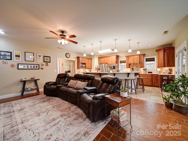 living room featuring ceiling fan