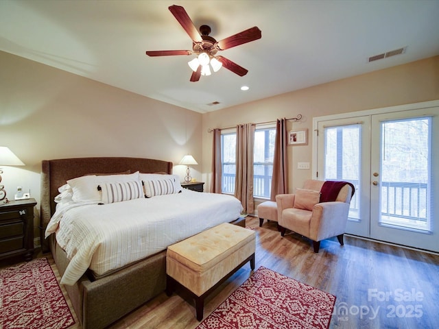 bedroom featuring access to exterior, ceiling fan, french doors, and hardwood / wood-style floors