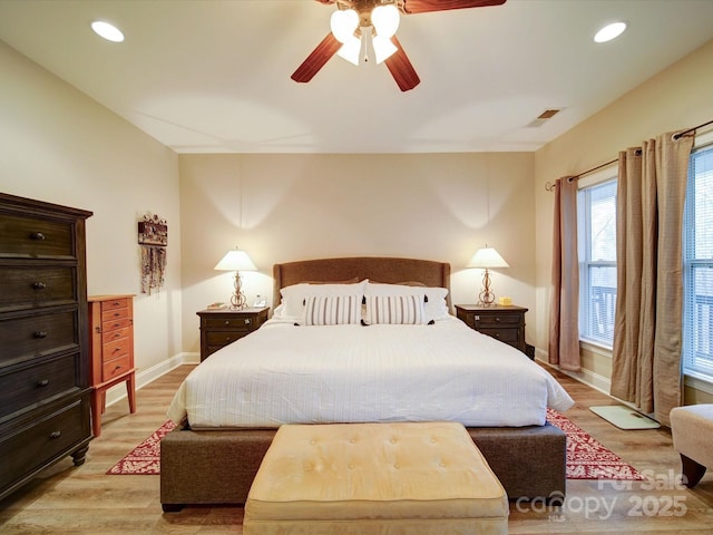 bedroom featuring ceiling fan and light hardwood / wood-style flooring