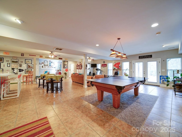 playroom with french doors, light tile patterned floors, ceiling fan, and pool table