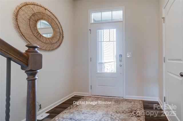 entryway with dark hardwood / wood-style floors